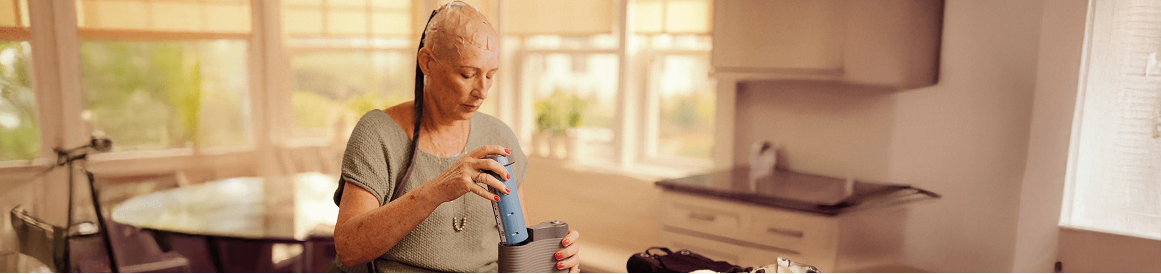 Danile at home while using Optune Gio.