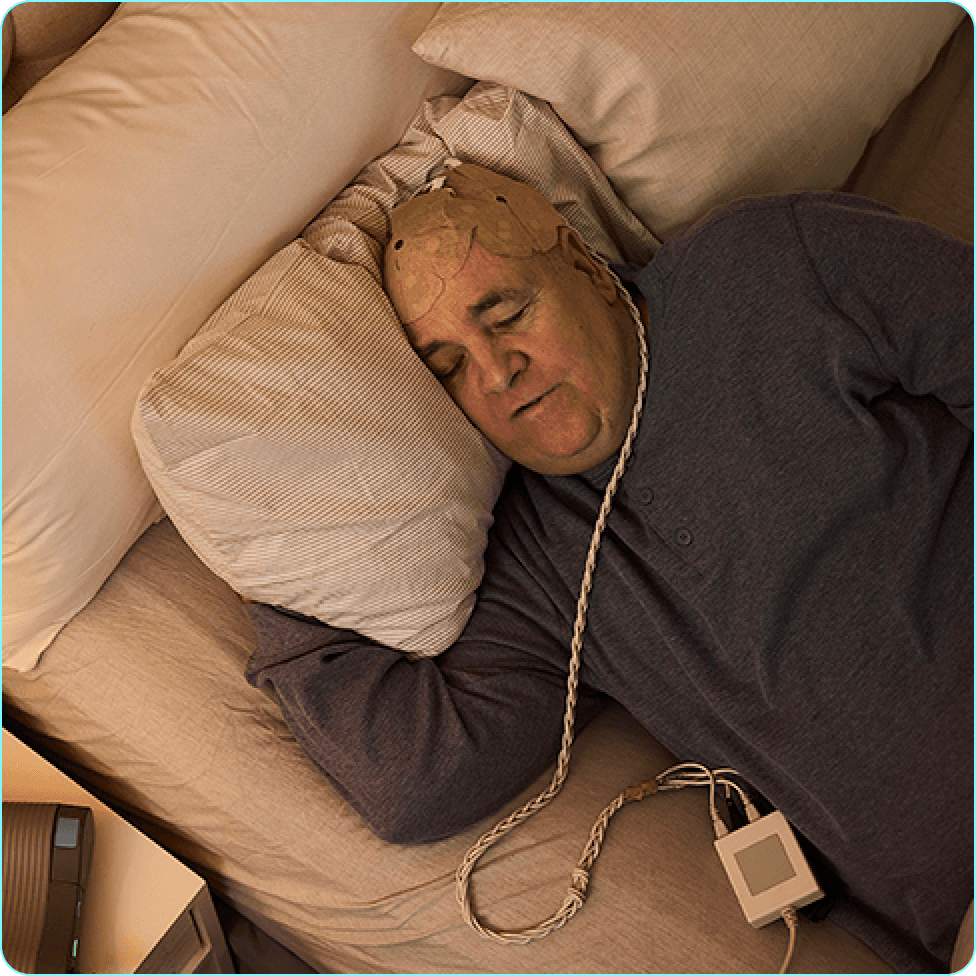 Danile drying her scalp with a towel.